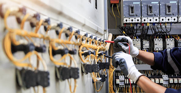 Professional Electrician technician working in Plains, KS